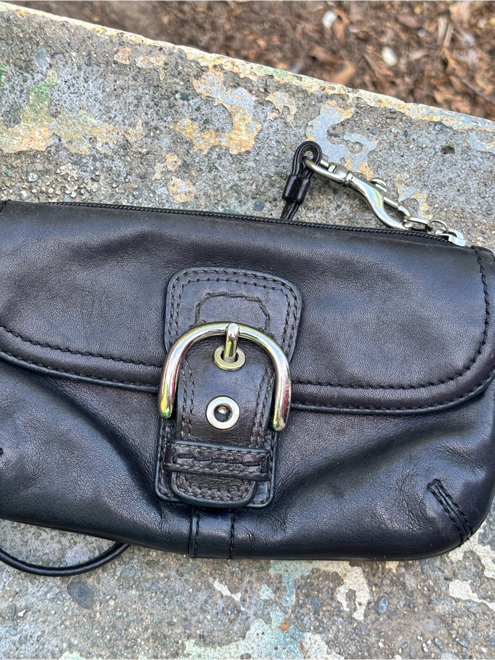 Sleek Black Leather Clutch with Buckle Accent